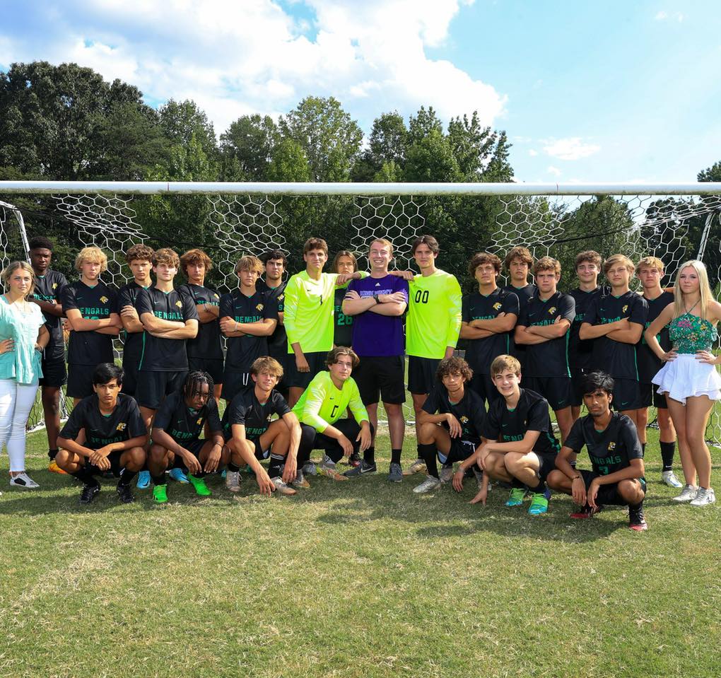 Girls and boys after paying football