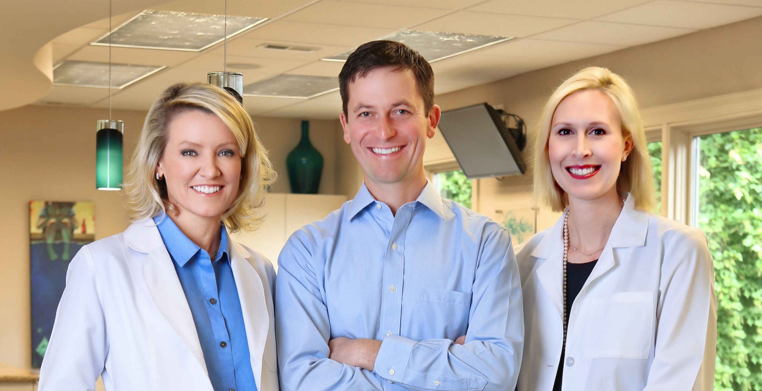 Dr. Mitchell, Dr. Bartlett, Dr. Bell with smile face