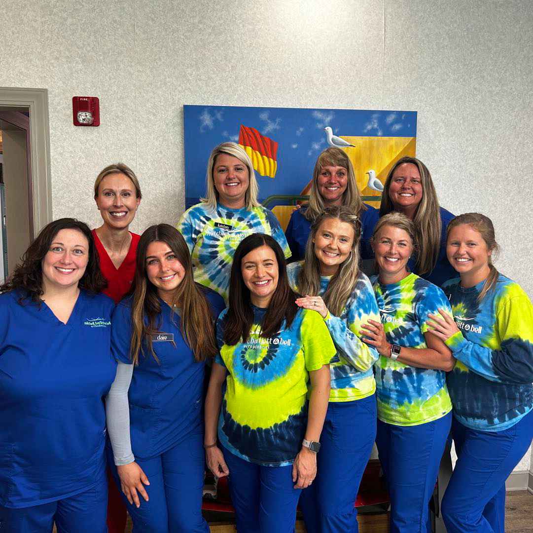Mitchell, Bartlett & Bell Orthodontics team tied dye shirts
